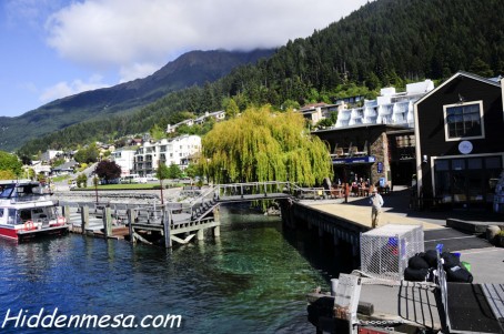 The Queenstown wharf along Lake Wakatipu is a popular tourist spot. Restaurants, bars, and shops, as well as many of the city's activities are located here. Image by Bonnie Fink