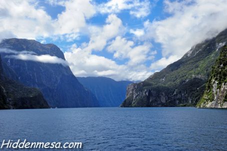 Clouds hanging over the mountains in Milford Sound New Zealand. Image by Donald Fink