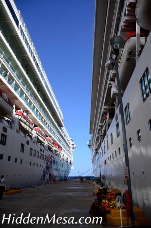 Two ships, the Norwegian Dawn and the Norwegian Pearl are docked together in Cozumel. Image by Donald Fink