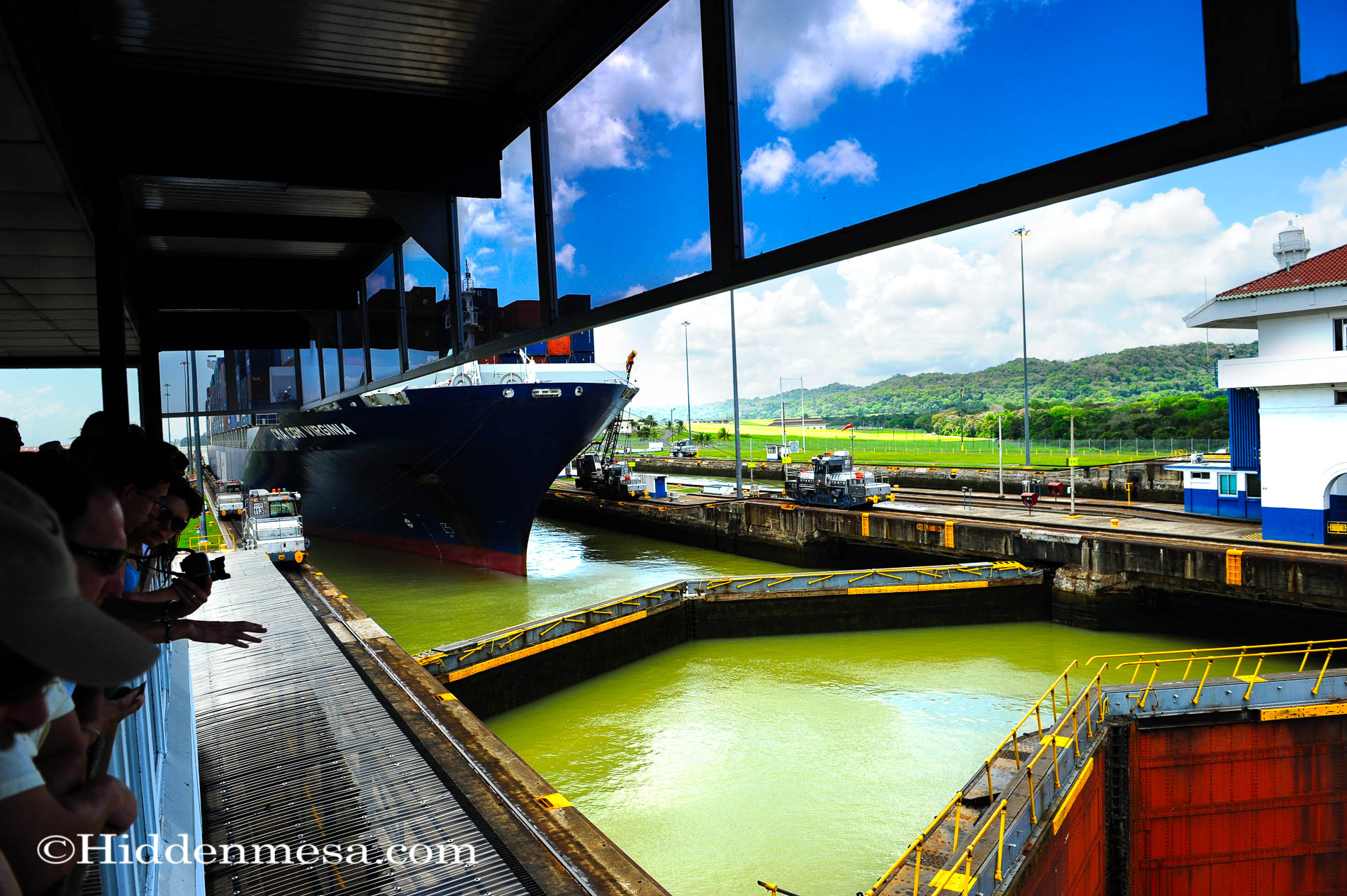 A cargo ship being pulled through the Gatun Locks Panama Canal
